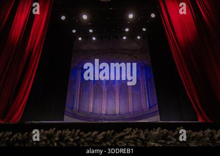 Empty Theater Stage with Red Velvet Curtains Stock Photo