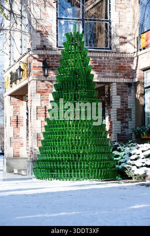 Vladikavkaz, Russia - January 03, 2026 : A Christmas tree made from empty glass bottles . Stock Photo