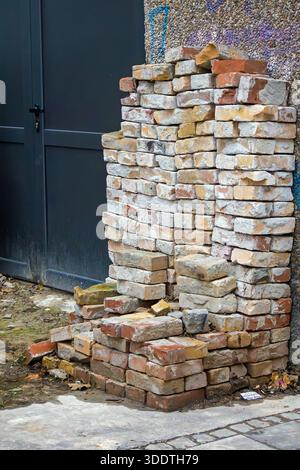 Reconstructed bricks recycled made from crushed waste manufactured product material outside on a street Stock Photo
