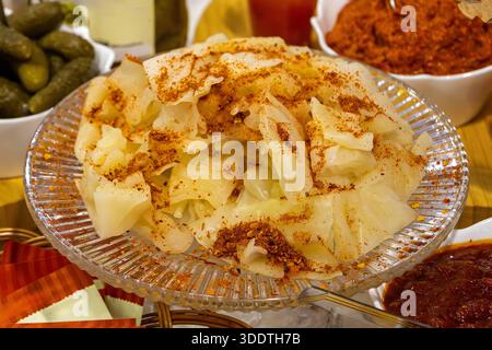 Sauerkraut finely cut raw cabbage fermented by various lactic acid bacteria and sprinkled with red pepper Stock Photo