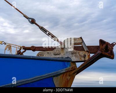 The rusty pawl bar located on the bow of a docked commercial fishing vessel Stock Photo