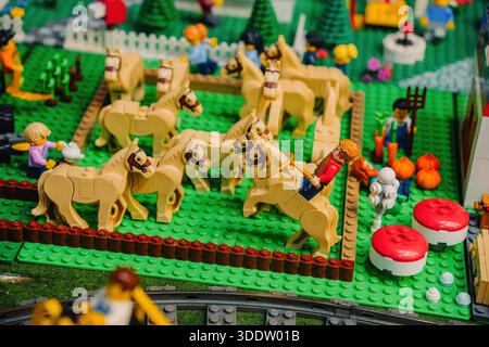 Prague, Czechia - 20 December 2025: Lego farm scene with horses and minifigures playing in colorful countryside setup Stock Photo
