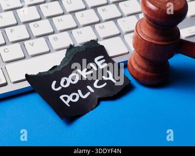 Cookie Policy Document with Judge Gavel on Computer Keyboard representing Website Privacy Laws GDPR Compliance and Internet Regulation Stock Photo