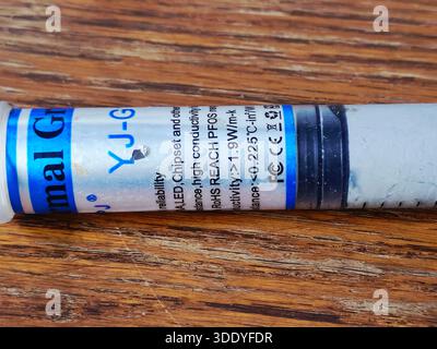 Cairo, Egypt, December 31 2025: YJ-G190 thermal grease, also known thermal paste or compound, a non-conductive, silicone-based, used to improve heat t Stock Photo