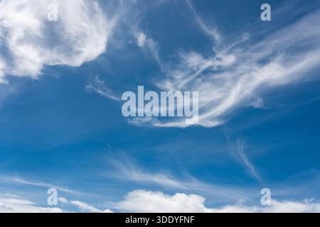 Whispy white clouds on a sunny summers day in New Zealand Stock Photo