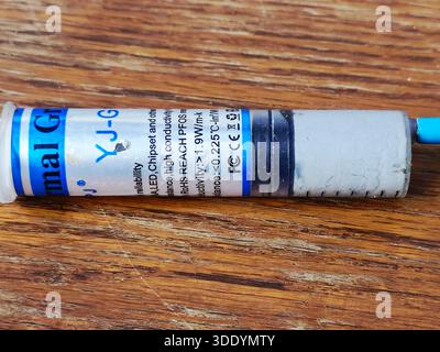 Cairo, Egypt, December 31 2025: YJ-G190 thermal grease, also known thermal paste or compound, a non-conductive, silicone-based, used to improve heat t Stock Photo
