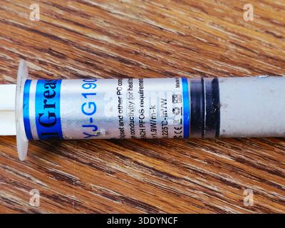 Cairo, Egypt, December 31 2025: YJ-G190 thermal grease, also known thermal paste or compound, a non-conductive, silicone-based, used to improve heat t Stock Photo