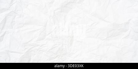 Top view and full frame of wrinkled or crumpled white paper texture is used as crumpled white paper background texture in decorative art work. Stock Photo
