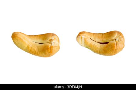 A set of two roasted or baked cashew nuts is isolated on white background with clipping path. Stock Photo