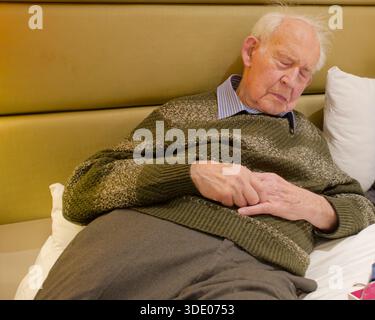 Senior elderly man in relaxing in hotel room Stock Photo