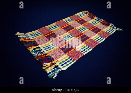 nice colors rug isolated on a dark blue background Stock Photo