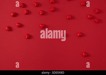 Small hearts on a red background Stock Photo