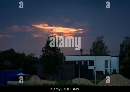 CARNIKAVA, LATVIA. 15th August 2025. Selective focus photo. Sunset in the sky above village. Stock Photo