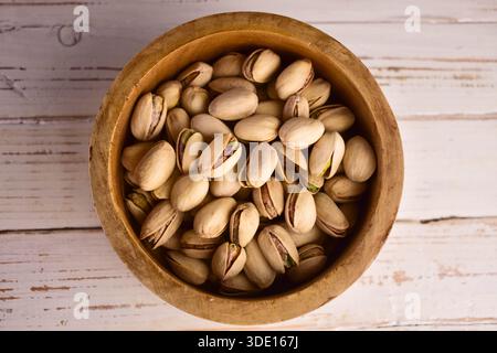 Hazelnuts in a wooden bowl. Flat lay. Stock Photo