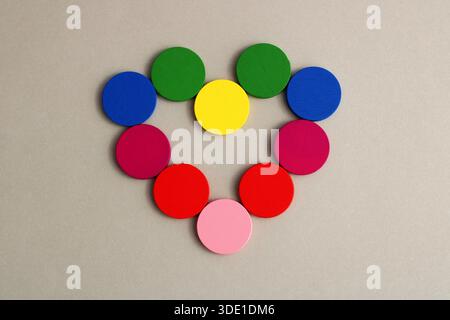 Heart formed with colored wooden circles Stock Photo