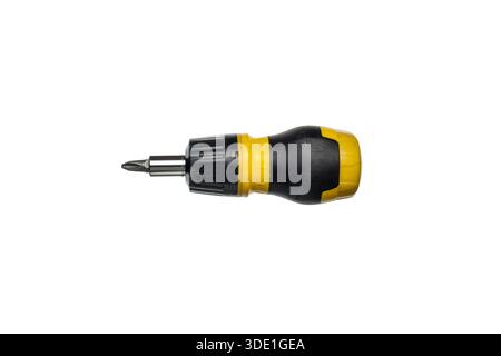 Stubby yellow and black ratchet screwdriver with a Phillips bit, isolated on white. Stock Photo