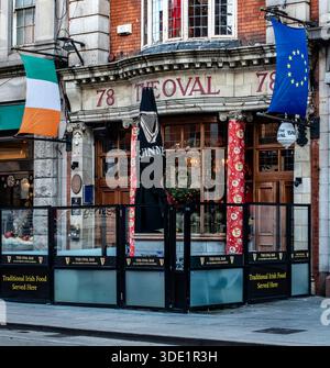 The Oval Bar on Middle Abbey Street, Dublin. Established in 1820, this historic Victorian pub features traditional wood, stone, and festive flags. Stock Photo