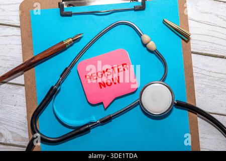 Register now message written on ripped torn paper background. Conceptual Register now symbol. Copy space. Stock Photo