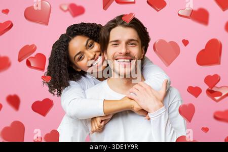 Young Couple Shows Love While Cuddling Over a Bright Yellow Background During Valentine's Season Stock Photo