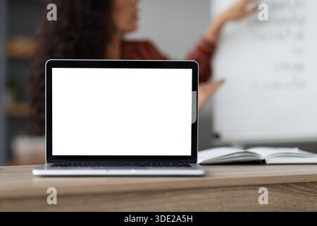 Teacher recording video, selective focus on blank gadget screen Stock Photo
