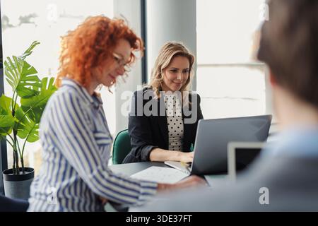 Business team reviewing project data, analysis financial situation. Stock Photo