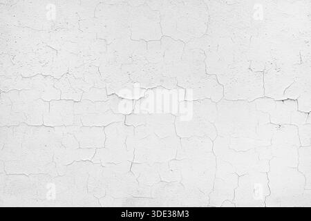White peeling paint on old wall cracked texture as background Stock Photo
