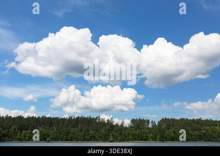 Lake in Polish Masuria on a sunny day. Picturesque cloudy sky, Masurian Lakeland, Poland Stock Photo