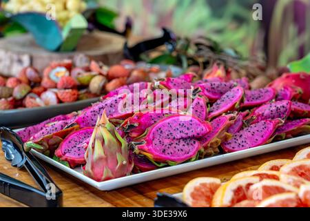 Ripe fresh dragon fruit cut on a plate Stock Photo