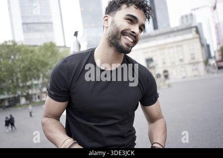 Jolly man with charisma in city, Moroccan ethnicity, North African ethnicity, lighthearted, easygoing, blissful, joy, joyful, happy, charismatic, happ Stock Photo