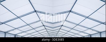 Blue Steel frame tents Background. Inside Big Canvas Tent Stock Photo