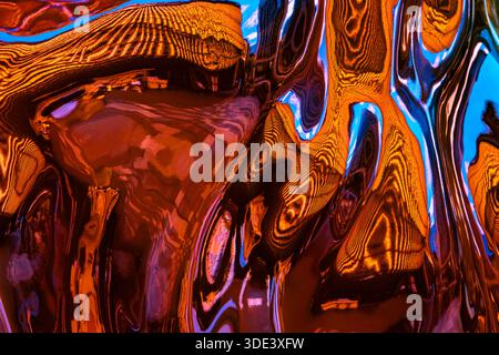 a vibrant, abstract photograph showcasing a mesmerizing, colorful liquid pour art. The image features swirling, fluid-like patterns in neon hues Stock Photo