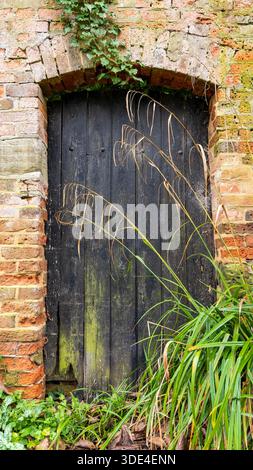 secret door in garden wall Stock Photo