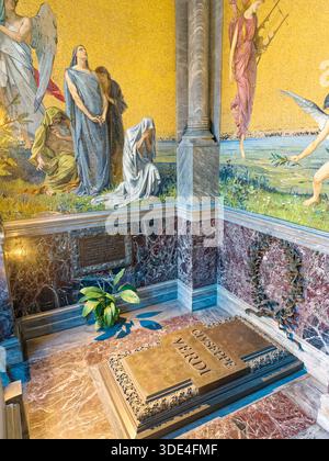 Milan Italy. A detailed view of the resting place of Giuseppe Verdi, featuring a bronze tomb, intricate mosaics, and opulent marble Stock Photo