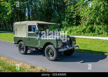 A 1956 Series 1 Land Rover car with its sturdy chassis and green ...