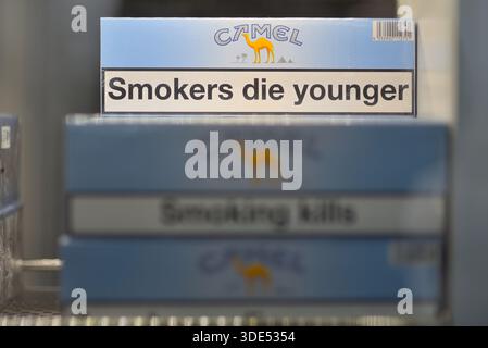 Camel cigarette packs with health warnings displayed on a shelf in  Istanbul, Turkey on 15 December 2025 Stock Photo