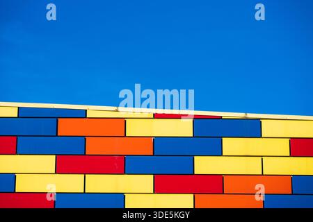 Minimalistic architectural background with strong horizontal lines, bright colors, and copy space. Concept of modern design, creativity, and urban aes Stock Photo