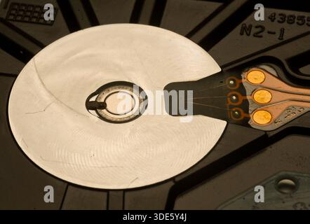A damaged hard drive from an Apple computer. Stock Photo