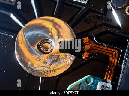 A damaged hard drive from an Apple computer. Stock Photo