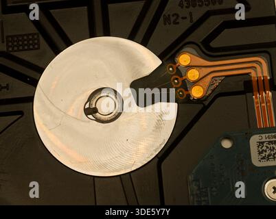 A damaged hard drive from an Apple computer. Stock Photo
