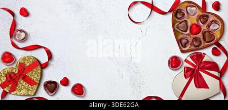 Heart-Shaped Chocolate Boxes and Red Ribbons Stock Photo