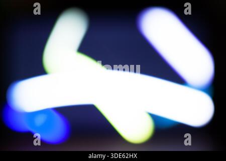 Abstract Blurred Light Streaks in Motion with Neon Colors on Dark Background Stock Photo