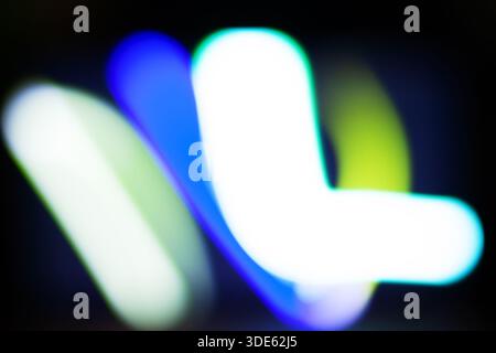 Abstract Neon Light Blur - Colorful Defocused Motion in Blue, Green, and White Stock Photo