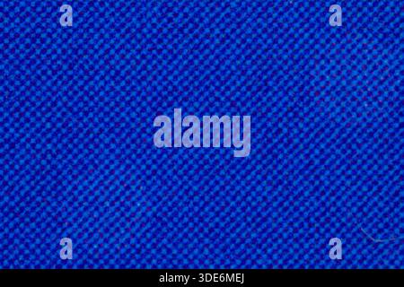 Blue synthetic fabric swatch showing tightly woven threads and fine texture Stock Photo