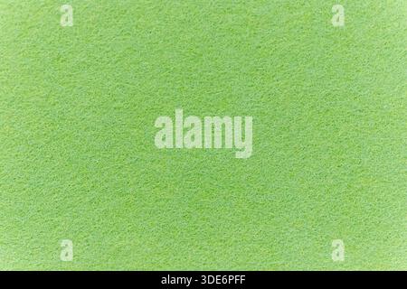 Green felt fabric showing a detailed texture, perfect for backgrounds and crafting Stock Photo