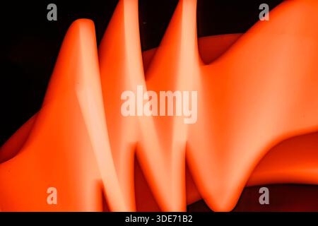 Abstract image of blurry motion, orange light painting effect, creating a contemporary art background Stock Photo