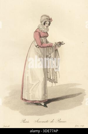 Servant at the baths, Paris, early 19th century, in lace bonnet and Elizabethan ruff collar, pink dress and white apron, carrying a dish of soap and bath linen. Servante de Bains. Handcoloured copperplate engraving by Georges Jacques Gatine after an illustration by Louis-Marie Lante from Ouvrieres de Paris (Tradeswomen of Paris), Paris, 1823. Stock Photo
