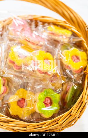 Wrapped Easter Cookie Sandwiches in Basket Stock Photo
