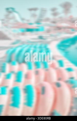 Blurred photo of inflatable water slide rings, summer abstract background or wallpaper. Stock Photo