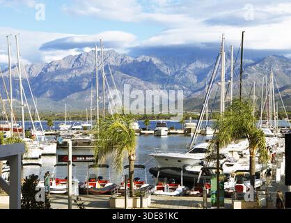 Calvi marina, with the mountains of the Balagne region in the Haute-Corse department, Corsica, France Stock Photo