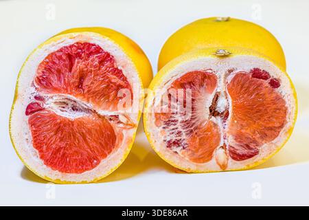 Yellow Pomelo with sliced isolated on white background. Clipping path. Stock Photo